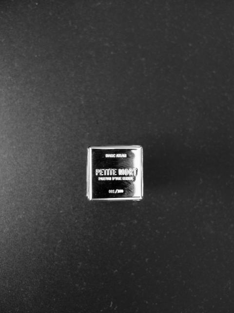 The metal stamped bottle stopper seen  from above