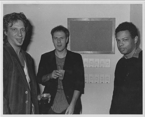 Dennis Cooper posing between Richard Hell and friend in the 80's